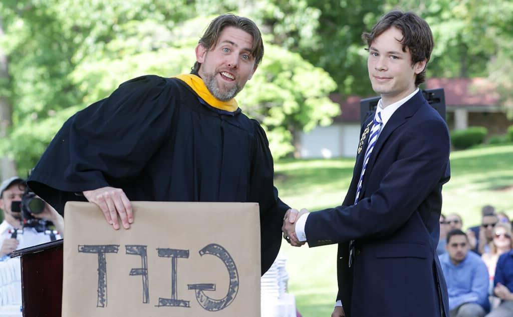 Presenting an award at graduation.